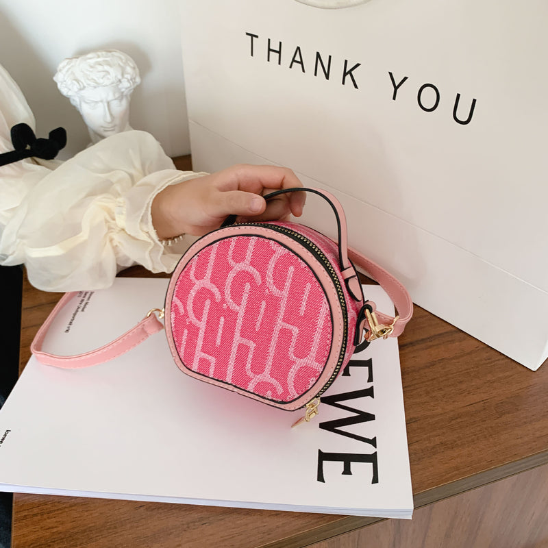 Small round bag with letters